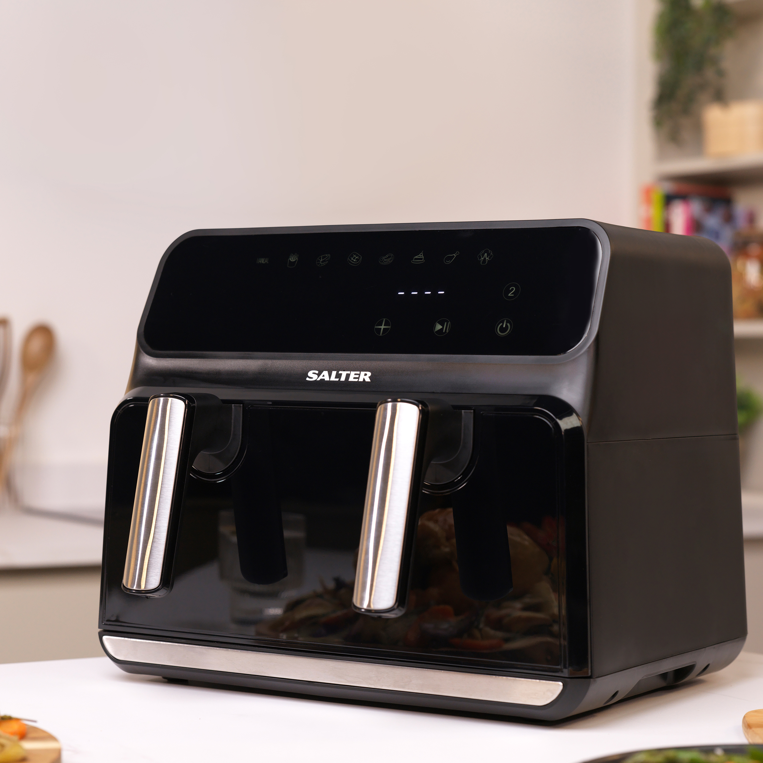 A salter XL Air Fryer on a white Counter top