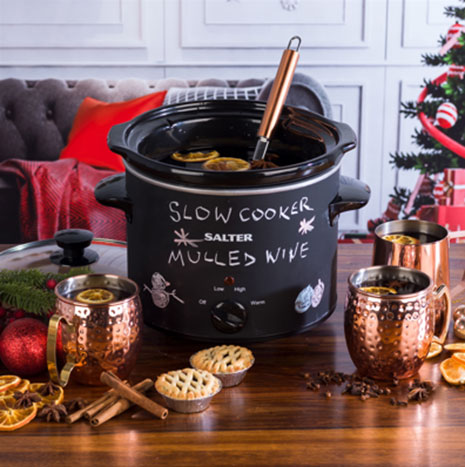 A Salter chalkboard slowcooker with notes written on the side of it A Salter chalkboard slowcooker with notes written on the side of it