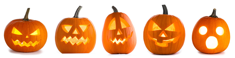 5 pumpkins with different facial expressions carved into them